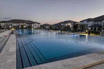 Massive luxe infinity-edge, olympic-size swimming pool